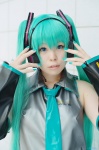 aqua_hair cosplay default_costume detached_sleeves hatsune_miku headset katakura_rin tie twintails vocaloid rating:Safe score:0 user:nil!