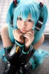 aqua_hair boots cosplay default_costume detached_sleeves hatsune_miku headset pleated_skirt skirt thigh_boots thighhighs tie twintails uriu vocaloid zettai_ryouiki rating:Safe score:1 user:nil!
