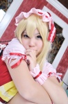 bed blonde_hair blouse cosplay flandre_scarlet hat irori touhou vest wings rating:Safe score:0 user:nil!