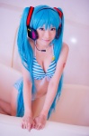 aqua_hair bathroom bathtub bikini cleavage cosplay hatsune_miku headset mashiro_yuki project_diva swimsuit twintails vocaloid rating:Safe score:0 user:nil!