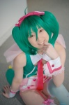 collar cosplay cuffs garter_straps green_hair hairbow macross macross_frontier miki ranka_lee red_eyes shorts thighhighs tie twintails vest rating:Safe score:0 user:pixymisa