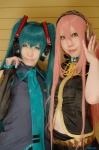 aqua_hair cosplay default_costume haruka hatsune_miku headset mai megurine_luka pink_hair twintails vocaloid rating:Safe score:0 user:Log