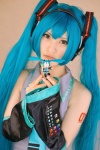 aqua_hair cosplay default_costume detached_sleeves hatsune_miku headset hina tie twintails vocaloid rating:Safe score:1 user:nil!