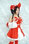 cosplay detached_sleeves dress hairbow hakurei_reimu kishigami_hana miko thighhighs touhou zettai_ryouiki rating:Safe score:0 user:nil!