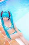 aqua_hair bikini cleavage cosplay hatsune_miku headset mashiro_yuki pool project_diva swimsuit twintails vocaloid wet rating:Safe score:0 user:nil!