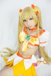 blonde_hair choker cosplay croptop cure_sunshine hairbows heartcatch_precure! kanda_midori miniskirt myoudouin_itsuki pretty_cure skirt twintails underboob rating:Safe score:5 user:xkaras