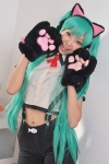 animal_ears aqua_hair blouse cat_ears choker cosplay hatsune_miku headset necoco necosmo paw_gloves project_diva suspenders trousers twintails vocaloid rating:Safe score:1 user:nil!