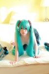 aqua_hair arai_yomi bed cleavage cosplay hatsune_miku headset pleated_skirt skirt thighhighs topless twintails vocaloid rating:Questionable score:1 user:nil!