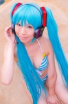 aqua_hair bikini cleavage cosplay hatsune_miku headset mashiro_yuki project_diva swimsuit twintails vocaloid rating:Safe score:1 user:nil!