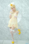 akimu babydoll blonde_hair blue_eyes bracelets cosplay fingerless_gloves fishnet_stockings flower gloves hairbow hair_clips kagamine_rin necklace panties thighhighs vocaloid rating:Safe score:3 user:pixymisa