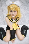 blouse cosplay detached_sleeves hairbow hair_clips headset hiokichi kagamine_rin leggings pantyhose sheer_legwear shorts vocaloid rating:Safe score:2 user:nil!
