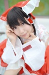 amatsuka_miyu blouse cosplay detached_sleeves hairbow hakurei_reimu miko pleated_skirt skirt touhou rating:Safe score:0 user:nil!