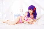 bed bikini cleavage cosplay fate/series fate/stay_night hair_ribbons matou_sakura purple_hair sachi_budou side-tie_bikini swimsuit rating:Safe score:0 user:nil!
