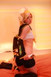 ass bed blonde_hair boots cosplay detached_sleeves hairbow headphones kagamine_rin panties shorts tanaka_mana vocaloid rating:Safe score:0 user:shiwahentai