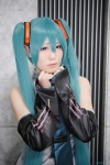 aqua_hair blouse cosplay detached_sleeves hatsune_miku headset luka tie twintails vocaloid rating:Safe score:0 user:nil!