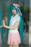aqua_hair blazer blouse cosplay hatsune_miku headdress hiiragi_haruka tiered_skirt twintails vocaloid rating:Safe score:0 user:pixymisa