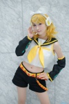 blonde_hair blouse cosplay detached_sleeves hairbow headset hiokichi kagamine_rin scarf shorts vocaloid rating:Safe score:0 user:pixymisa