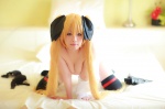 arai_yomi bed black_legwear blonde_hair blouse bottomless cleavage cosplay fate_testarossa hairbows lyrical_nanoha mahou_shoujo_lyrical_nanoha open_clothes thighhighs twintails rating:Questionable score:2 user:nil!
