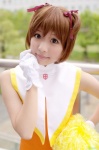 cardcaptor_sakura cheerleader cosplay gloves hair_ribbons kinomoto_sakura pom_poms zero_inch rating:Safe score:0 user:nil!