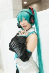 aqua_hair blouse blue_eyes chica cosplay detached_sleeves hatsune_miku headset pleated_skirt skirt twintails vocaloid rating:Safe score:0 user:pixymisa