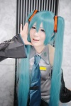 aqua_hair blouse cosplay detached_sleeves hatsune_miku headset luka pleated_skirt skirt tie twintails vocaloid rating:Safe score:0 user:nil!