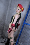ahoge ass beret blonde_hair bodysuit boots cammy_white camouflage capcom_gal cosplay fingerless_gloves gloves igarashi_nao pantyhose socks street_fighter twin_braids rating:Safe score:4 user:nil!
