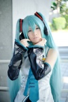 aqua_hair blouse cosplay detached_sleeves hatsune_miku headset pleated_skirt popuri skirt tie twintails vocaloid rating:Safe score:0 user:nil!