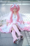 boots bow_(weapon) cosplay dress gloves hairbows kaname_madoka mumuko petticoat pink_eyes pink_hair puella_magi_madoka_magica shawl tiered_skirt twintails wings rating:Safe score:1 user:pixymisa