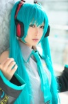 aqua_hair cosplay default_costume detached_sleeves hatsune_miku headset narihara_riku tie twintails vocaloid rating:Safe score:0 user:nil!