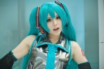 aqua_hair blouse cosplay detached_sleeves hatsune_miku headphones honma tie twintails vocaloid rating:Safe score:0 user:pixymisa