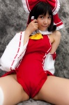 cosplay detached_sleeves hairbow hakurei_reimu lenfried miko one-piece_swimsuit swimsuit thighhighs touhou rating:Safe score:2 user:nil!