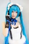 blue_hair bodice cosplay fingerless_gloves gloves hairband hatsune_miku headphones ribbon_tie tatsuki_(ii) twintails vocaloid rating:Safe score:2 user:pixymisa