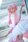 boots bow_(weapon) cosplay dress gloves hairbows kaname_madoka mumuko petticoat pink_eyes pink_hair puella_magi_madoka_magica shawl tiered_skirt twintails wings rating:Safe score:1 user:pixymisa