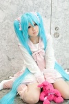 aqua_hair bow cosplay dress hatsune_miku kneesocks lots_of_laugh_(vocaloid) plushie rushi twintails vocaloid rating:Safe score:2 user:pixymisa
