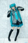 aqua_hair blouse cosplay detached_sleeves hatsune_miku headset kei pleated_skirt skirt thighhighs tie twintails vocaloid zettai_ryouiki rating:Safe score:1 user:nil!