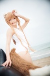 animal_ears beach cosplay horo ocean one-piece_swimsuit orange_hair rococo spice_and_wolf swimsuit tail whistle_around_the_world wolf_ears rating:Safe score:1 user:nil!