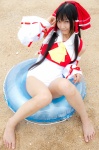 barefoot beach cosplay detached_sleeves hairbow hakurei_reimu lenfried miko one-piece_swimsuit swimsuit touhou rating:Safe score:0 user:nil!