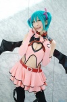 aqua_hair chii cleavage cosplay dress elbow_gloves fingerless_gloves garter_belt gloves hairbows hatsune_miku project_diva stirrup_socks tail twintails vocaloid wings world_is_mine_(vocaloid) rating:Safe score:1 user:nil!