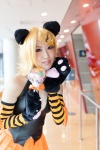 animal_ears blonde_hair cat_ears cat_paws cosplay detached_sleeves hair_clips halter_top kagamine_rin paw_gloves pleated_skirt skirt striped tomoshibi vocaloid rating:Safe score:0 user:pixymisa