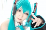 aqua_hair blouse cosplay detached_sleeves hatsune_miku headset iori tie twintails vocaloid rating:Safe score:0 user:nil!