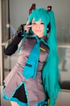 aqua_eyes aqua_hair blouse cosplay detached_sleeves hatsune_miku headset mitsuto pleated_skirt skirt tie twintails vocaloid rating:Safe score:0 user:pixymisa