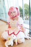 bows choker cosplay dress gloves hairbow kaname_madoka kneehighs kujyou_konegi pink_hair plushie puella_magi_madoka_magica red_eyes tiered_skirt twintails rating:Safe score:0 user:pixymisa