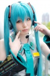 aqua_hair asami_uki cosplay default_costume detached_sleeves hatsune_miku headset tie twintails vocaloid rating:Safe score:0 user:nil!