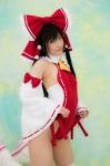 boots cosplay detached_sleeves hairbow hakurei_reimu lenfried miko one-piece_swimsuit swimsuit thighhighs touhou rating:Safe score:0 user:nil!