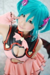 aqua_hair chii cleavage cosplay dress elbow_gloves fingerless_gloves gloves hairbows hatsune_miku project_diva twintails vocaloid wings world_is_mine_(vocaloid) rating:Safe score:2 user:nil!