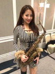 alto_saxophone asian black_and_white_dress boots brown_hair chair dress earring east_asian fur_trim instrument long_sleeves microphone saxophone short_dress taiwanese thigh_boots thighhighs wendy_wen rating:Safe score:0 user:zuxvejq