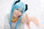 aoki aqua_hair cosplay glasses hatsune_miku headphones hoodie looking_over_glasses sound_(vocaloid) twintails vocaloid rating:Safe score:0 user:pixymisa