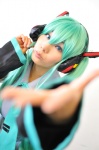 aqua_hair cosplay default_costume detached_sleeves hatsune_miku headset tenko tie twintails vocaloid rating:Safe score:0 user:nil!