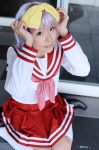 cosplay hairbow hiiragi_tsukasa lucky_star maritsuki_haru miniskirt pleated_skirt purple_hair sailor_uniform school_uniform skirt socks rating:Safe score:0 user:nil!