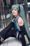 aqua_hair blouse cosplay detached_sleeves hatsune_miku headset maitako pleated_skirt skirt thighhighs tie twintails vocaloid zettai_ryouiki rating:Safe score:0 user:pixymisa